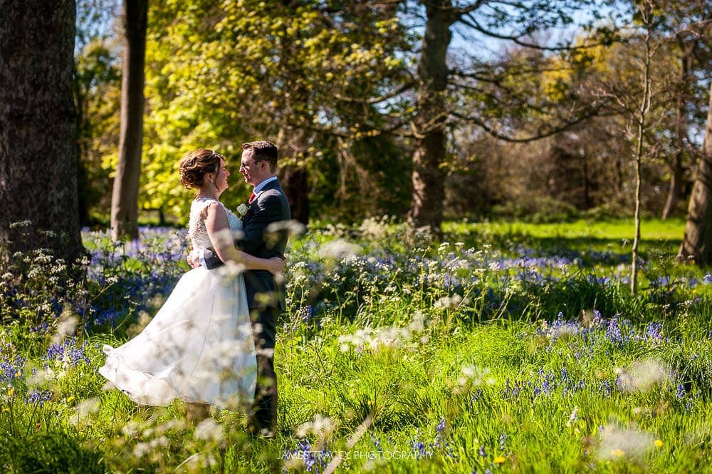 bride and groom in a field