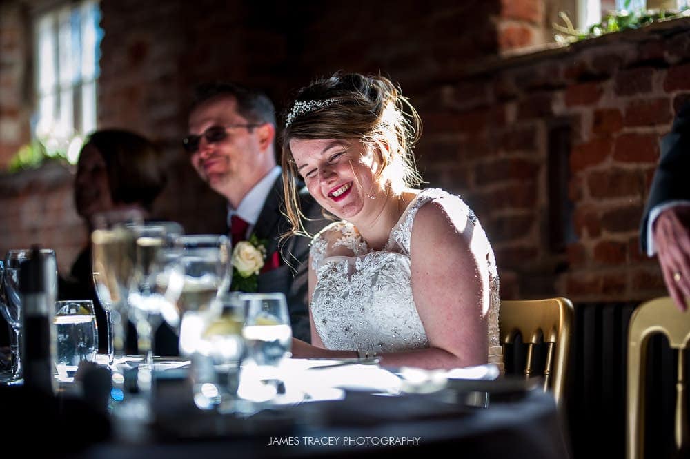 bride laughing at her wedding