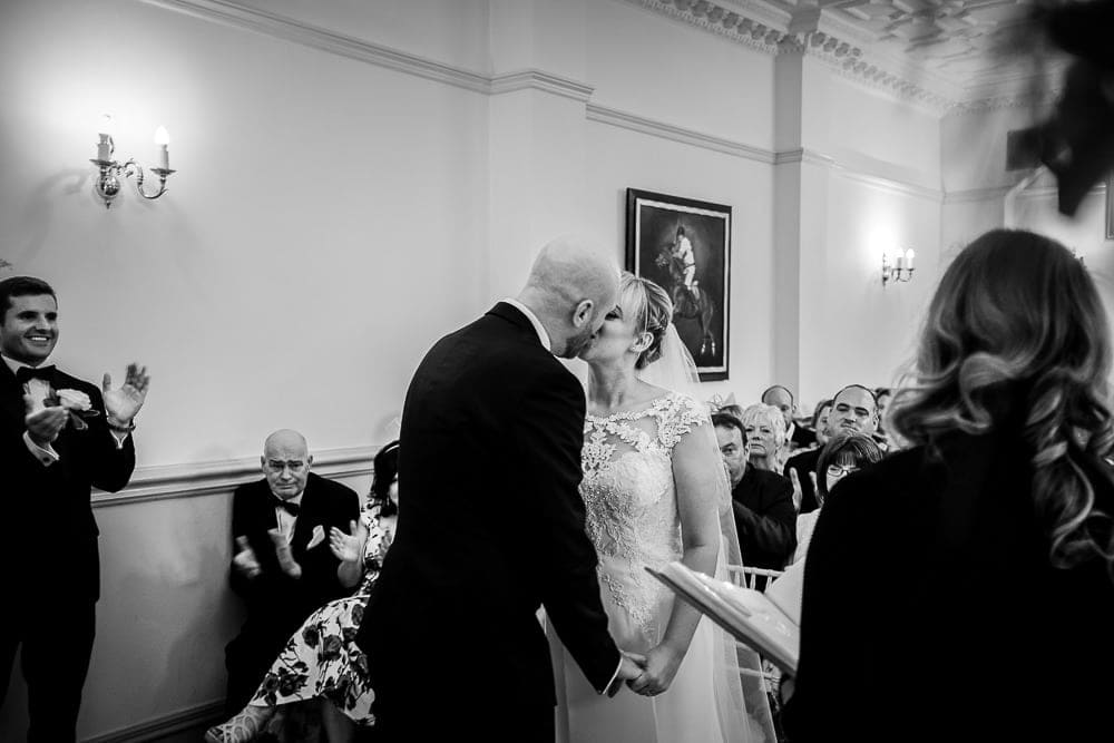 bride and groom kiss at nunsmere hall 