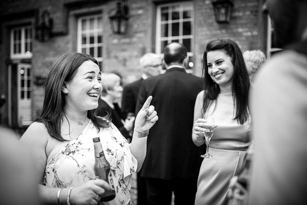 laughing wedding guests