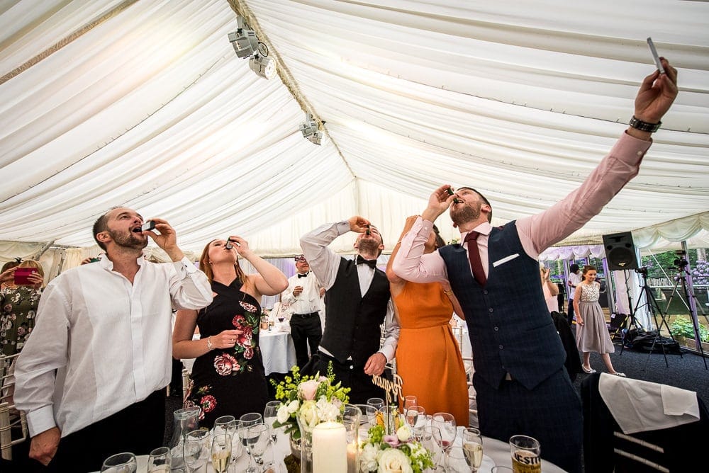 wedding guests downing jaeger