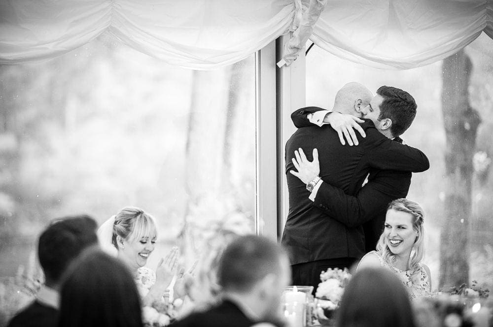 groom hugging his best man