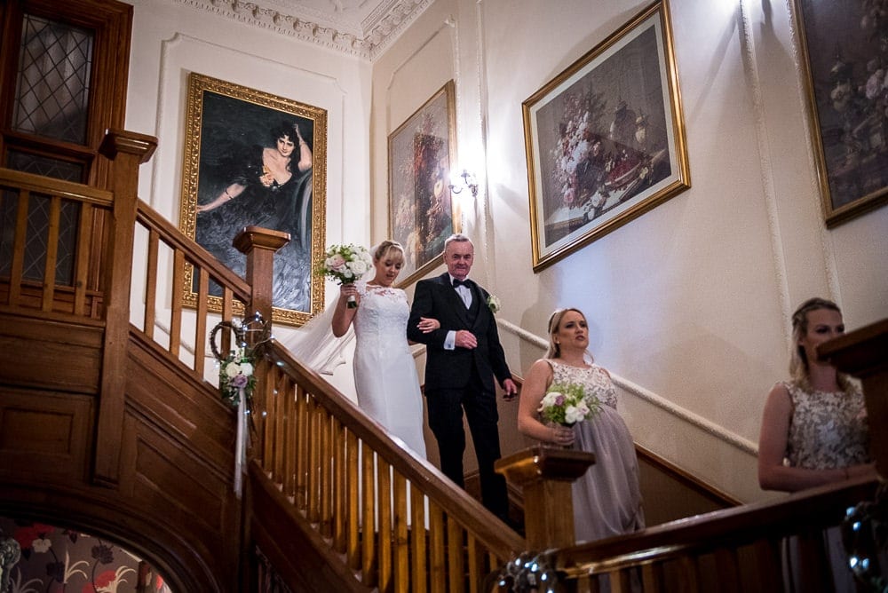 bride walking to wedding on stairs