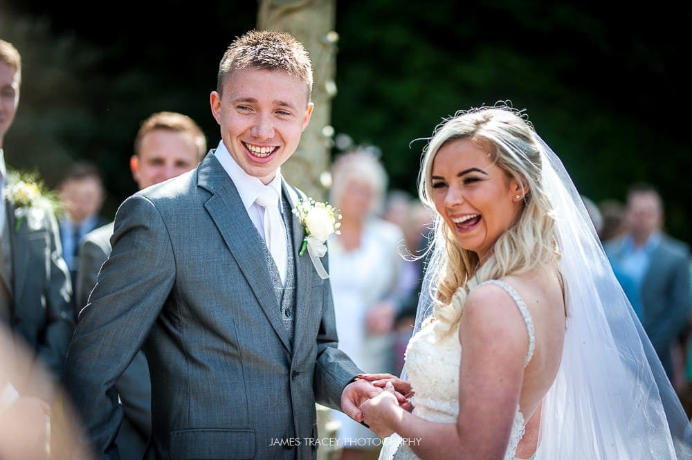 bride and groom laughing