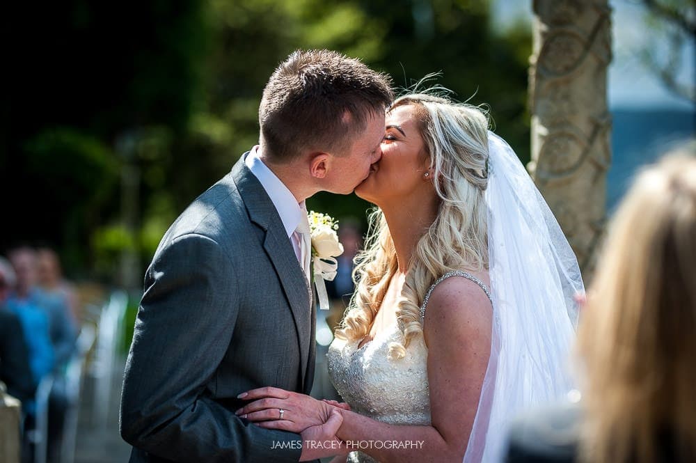 first kiss at outdoor wedding at saddleworth hotel