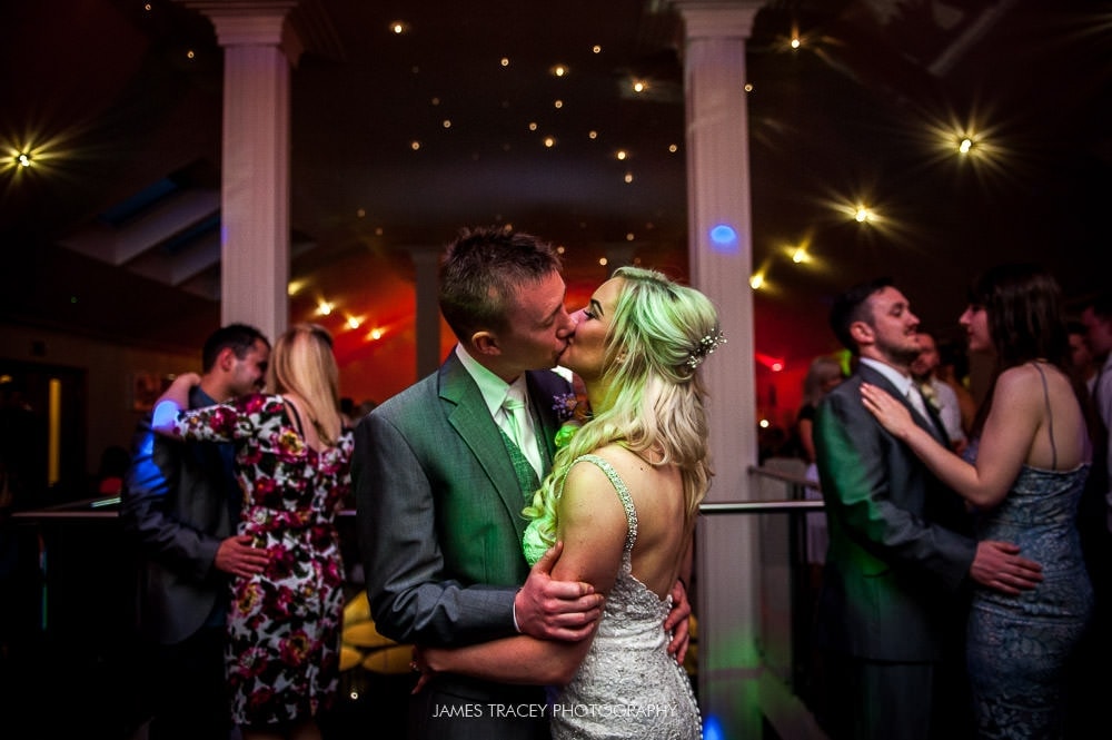 kissing at wedding dance