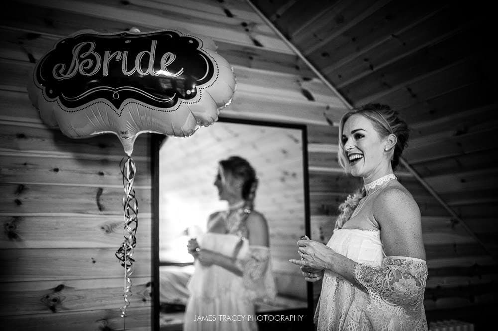 bride stood next to bride balloon