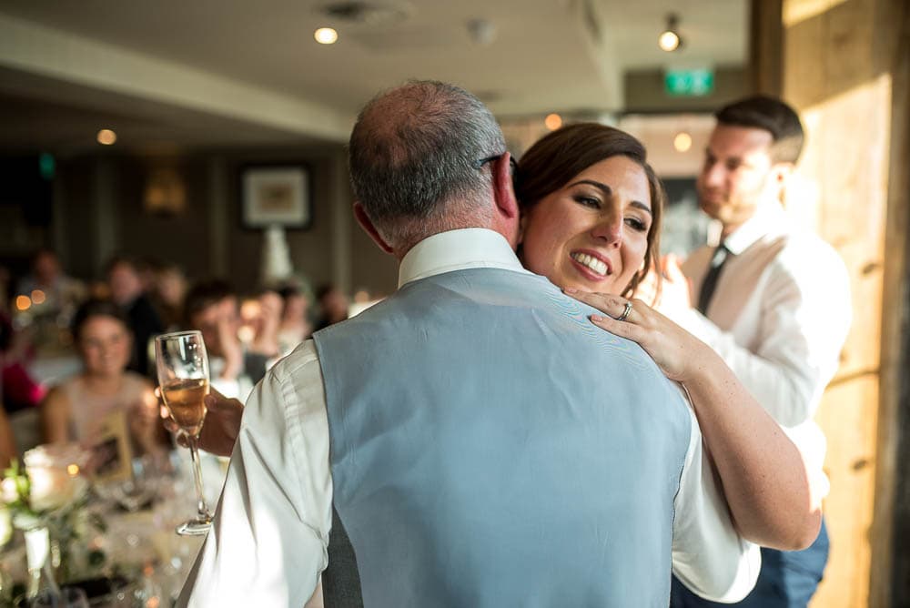 bride hugging her father at wedding at King street townhouse