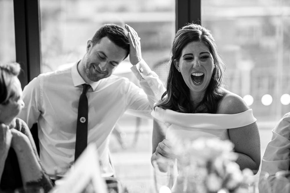 bride and groom laughing