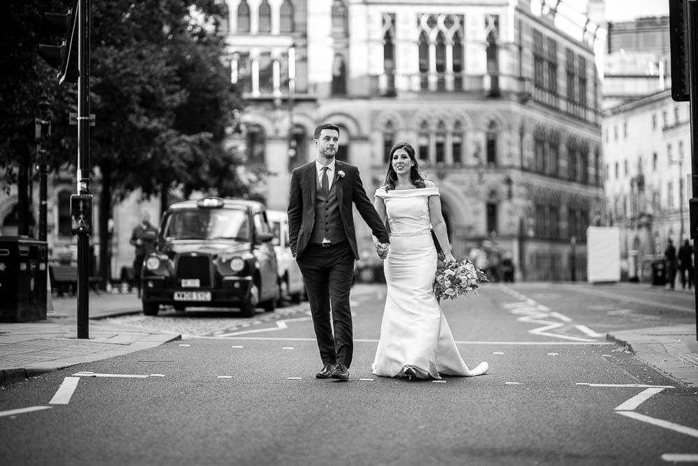 bride and groom in road