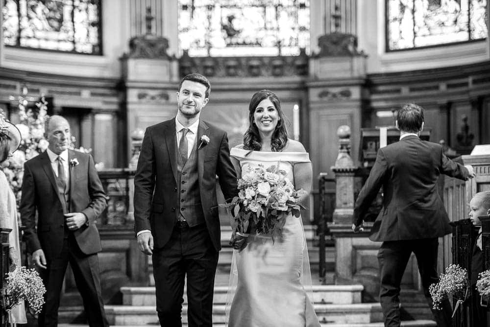 bride and groom walking back down the aisle