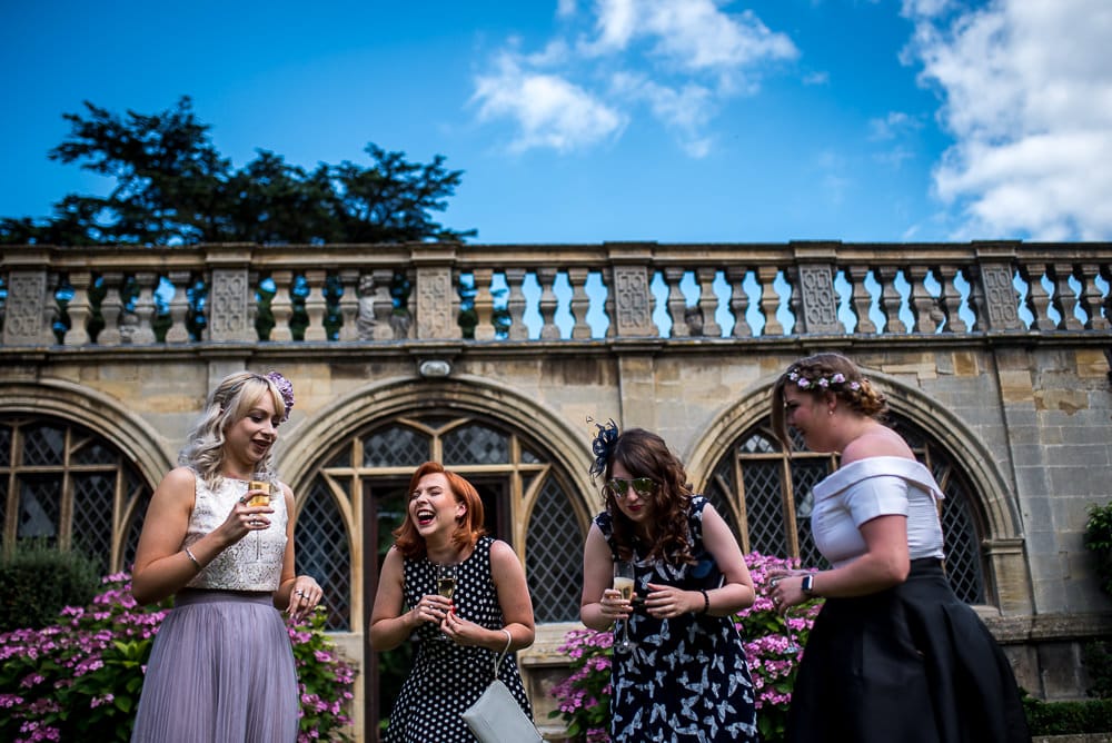 wedding guests laughing at rushton hall wedding