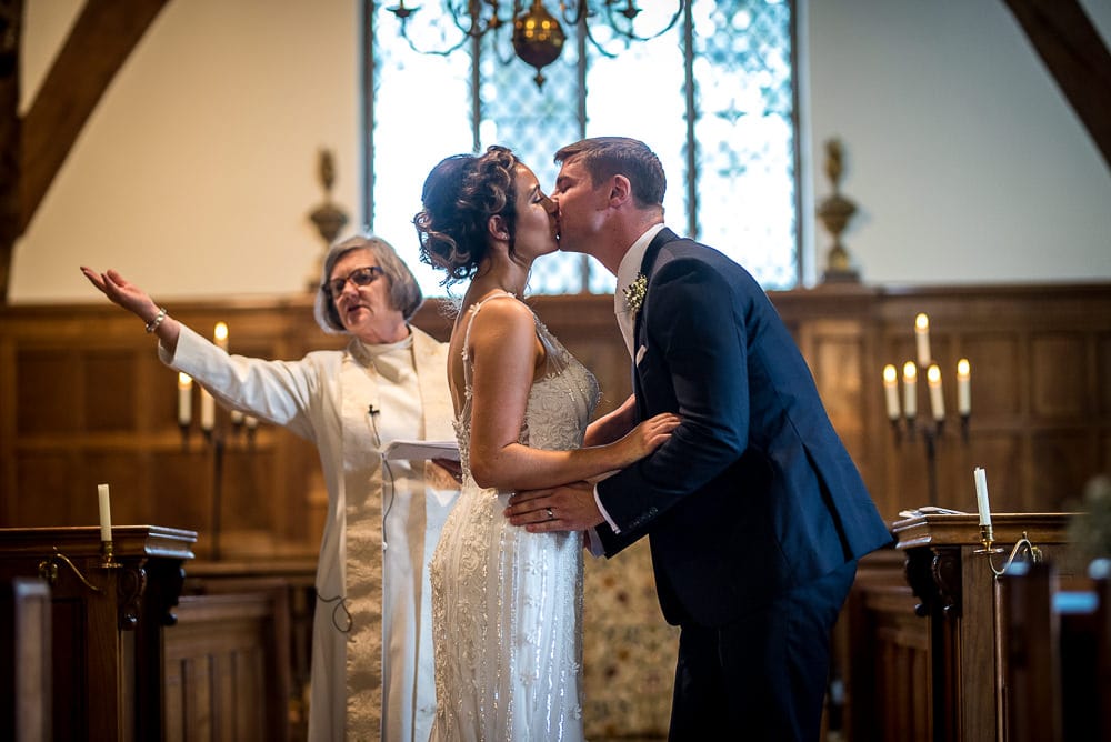 bride and groom kissing at church