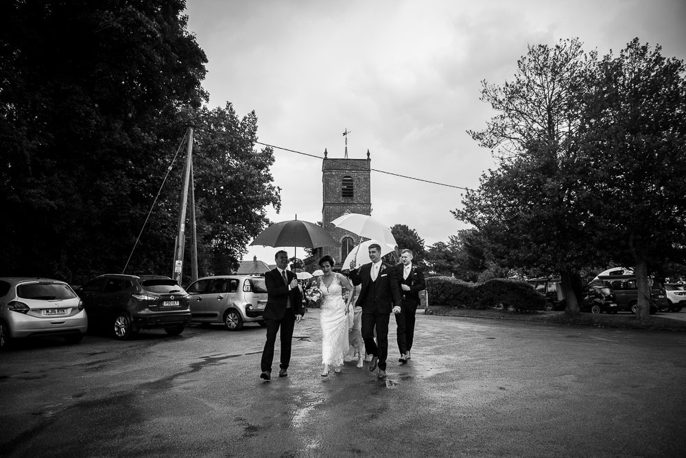 wedding party in the rain