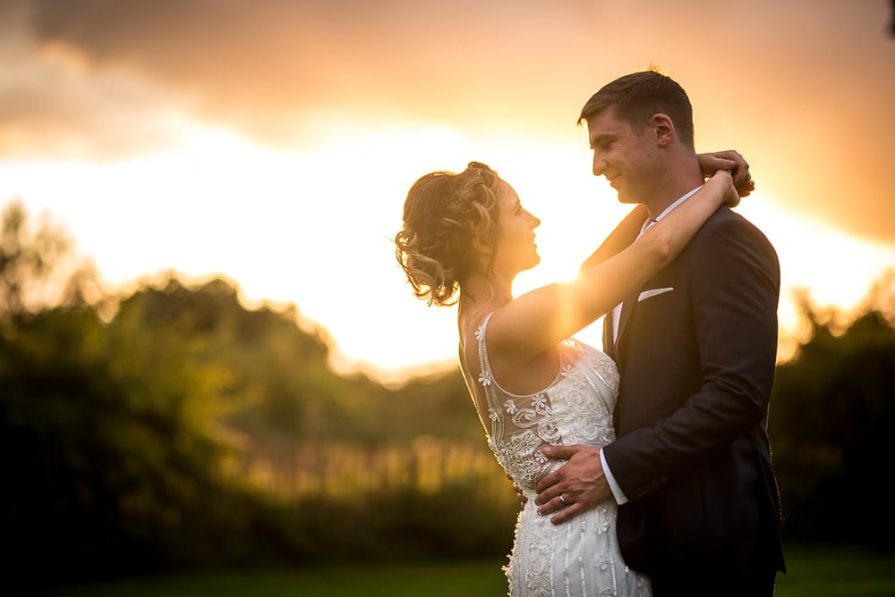 wedding couple in front of sunset