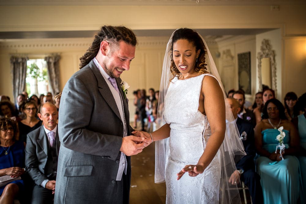 happy exchange of wedding rings at eaves hall