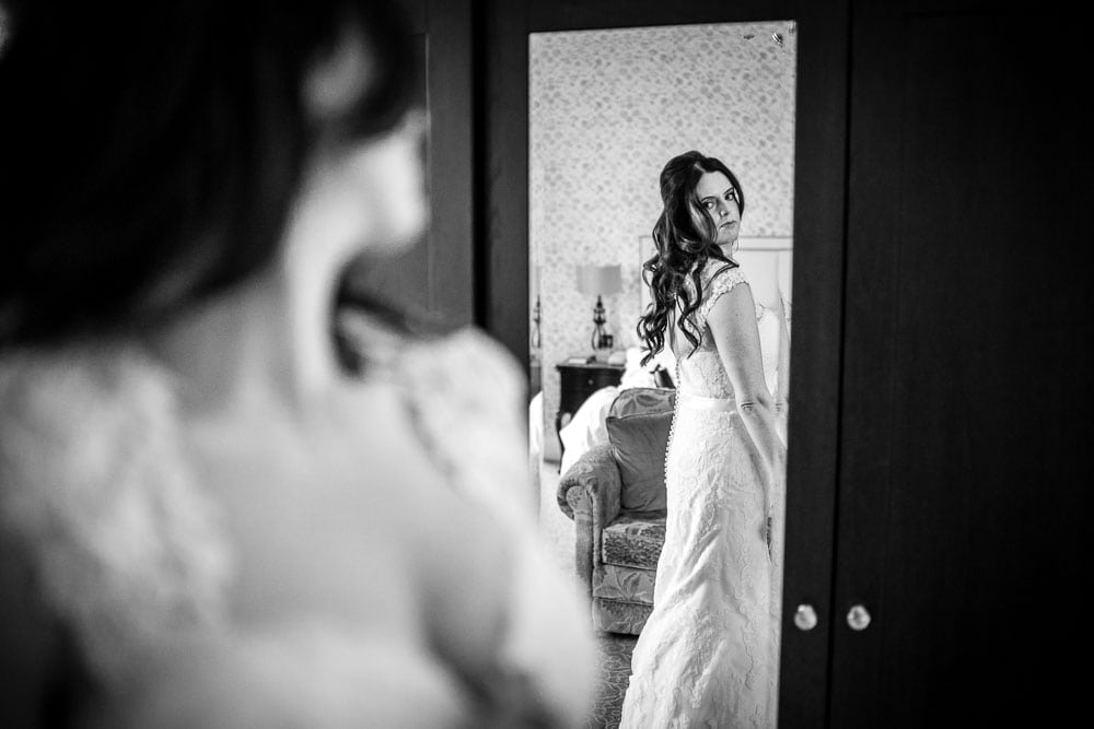 bride looking at her dress
