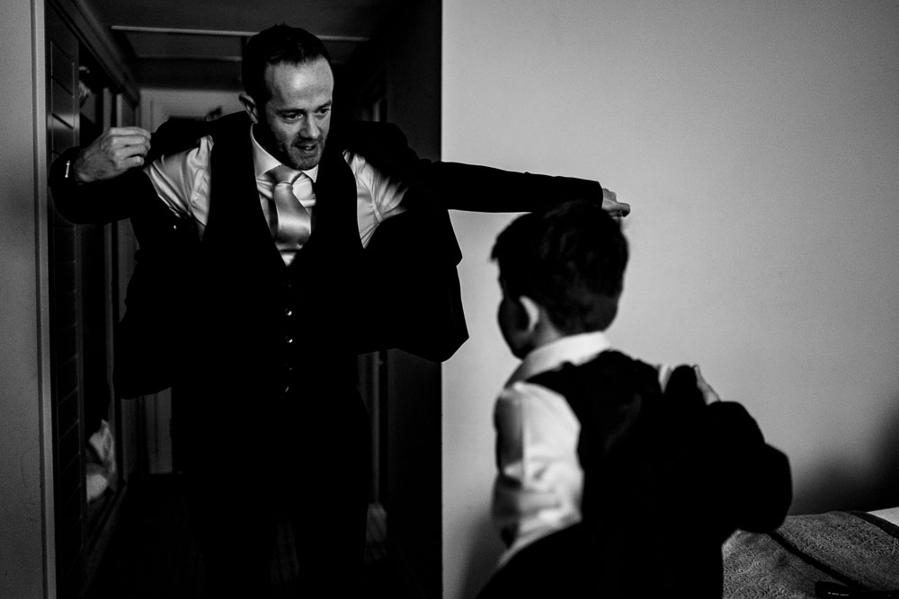 groom and son getting in jackets