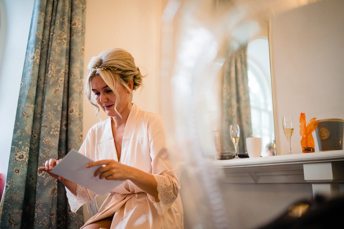 bride reading card from groom at gisburn park estate