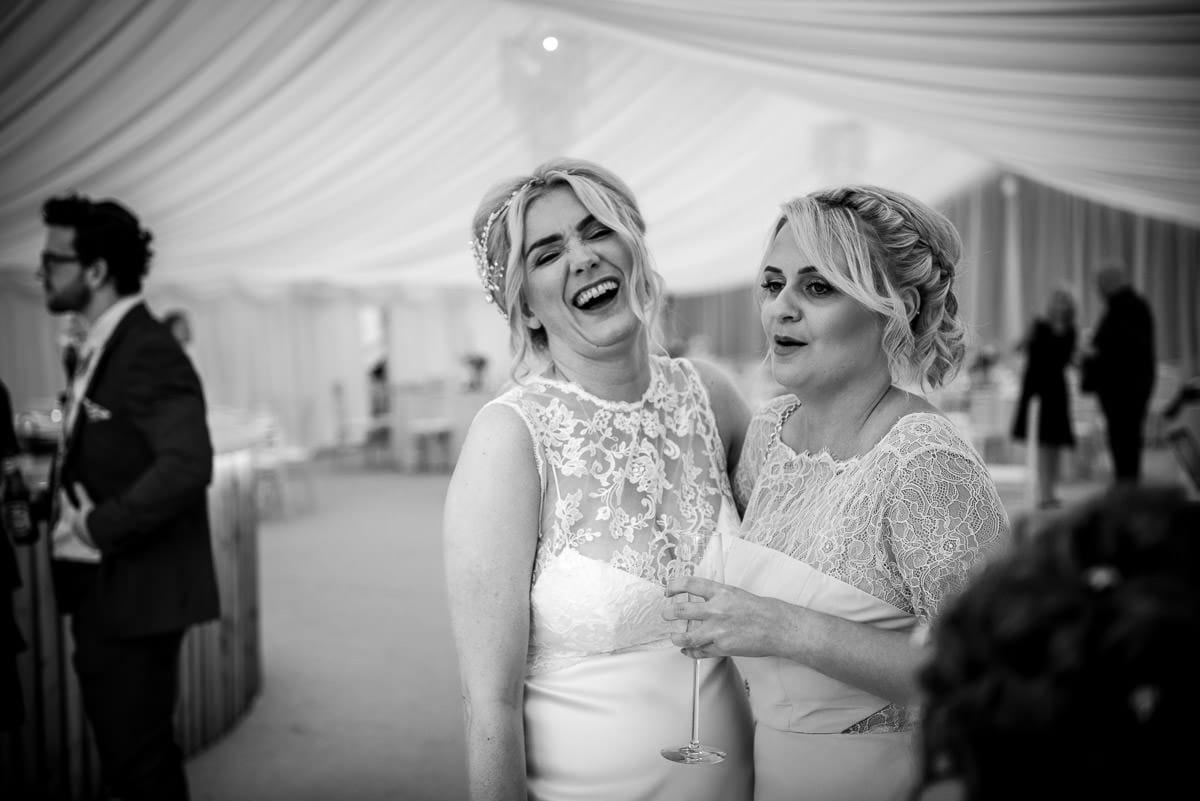 bride laughing with friend