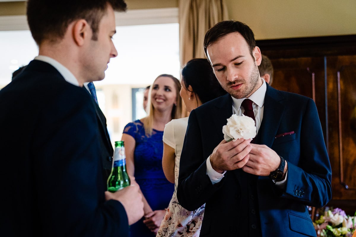 groom and his flower