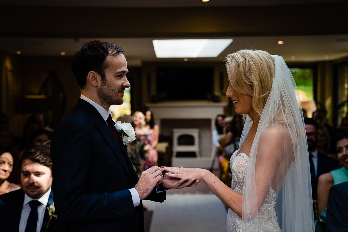 exchange of wedding rings at gilpin lake house