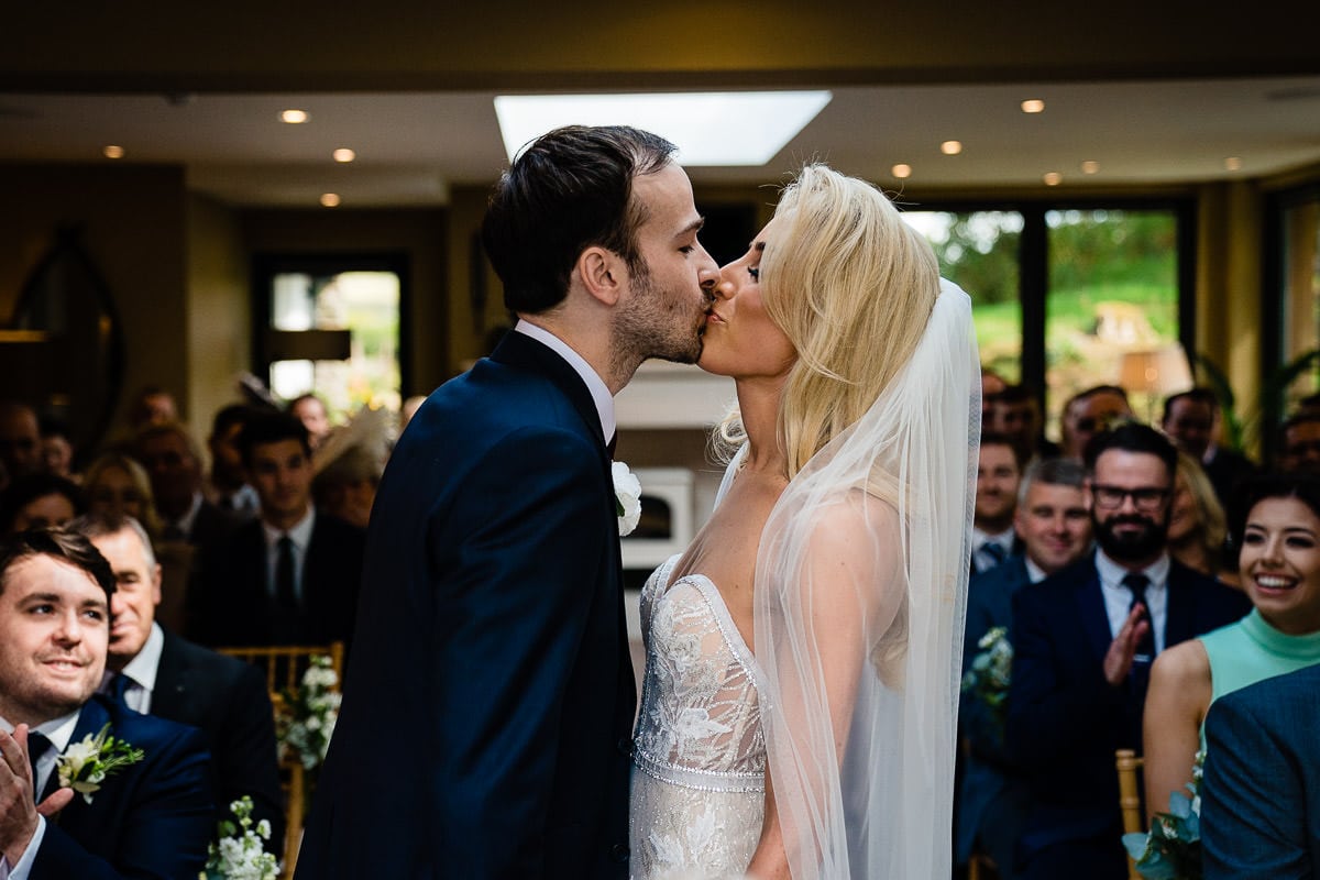 first kiss at wedding at gilpin lake house