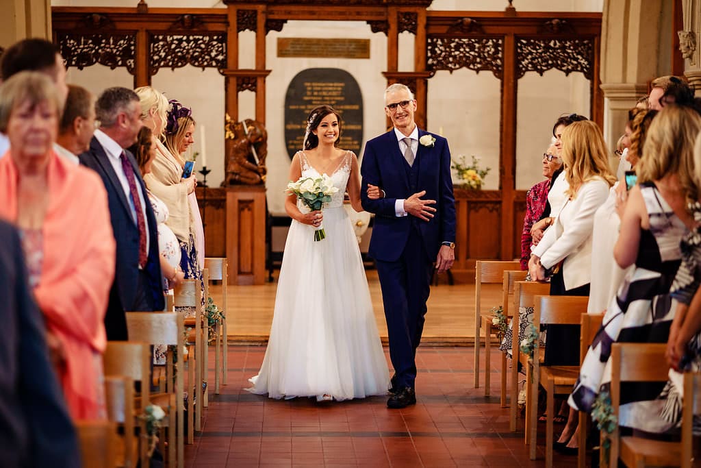 bride walking up the aisle at her wedding