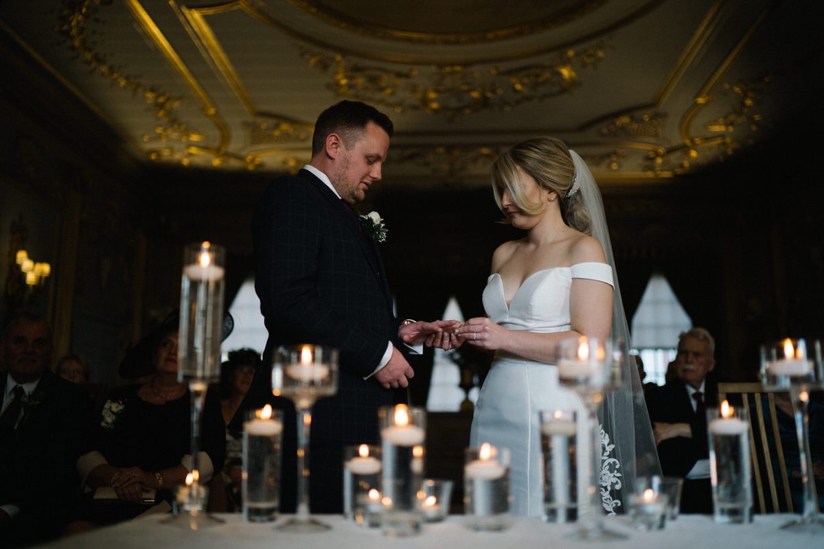 exchange of wedding rings at knowsley hall wedding