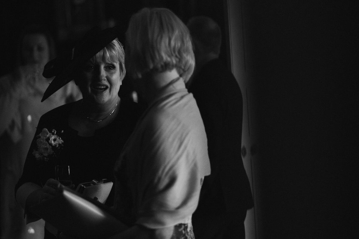 wedding guests chatting at knowsley hall