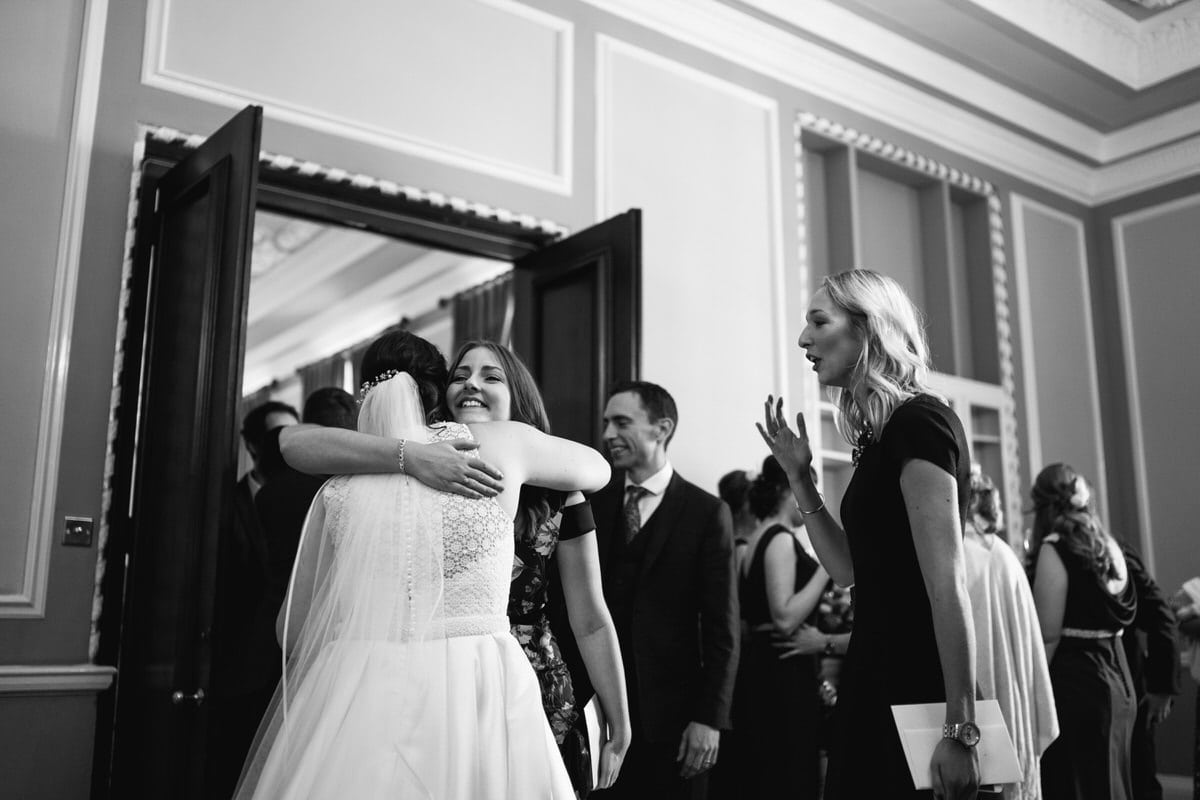 black and white hugs at Manchester hall wedding