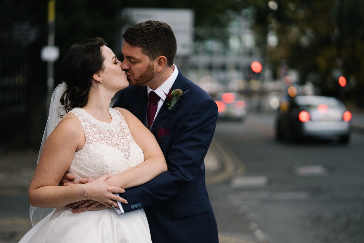 wedding couple kissing in manchester city centre