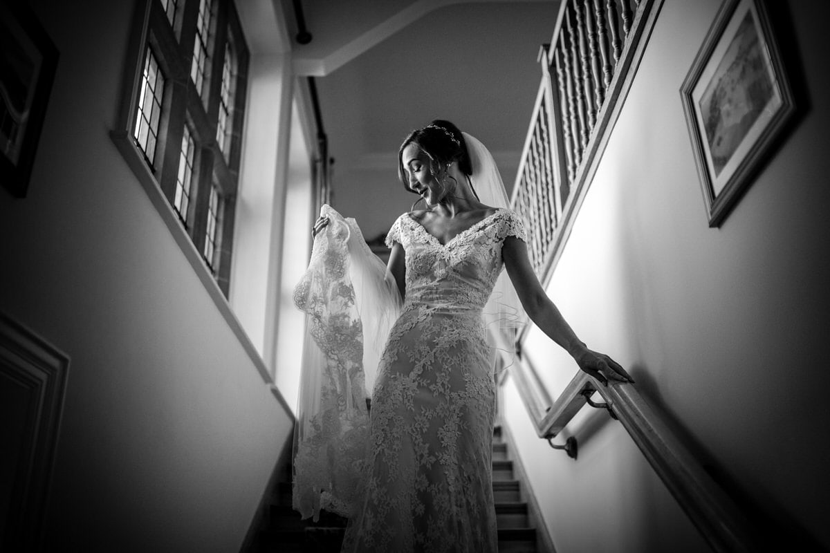 bride walking down the stairs at colshaw hall