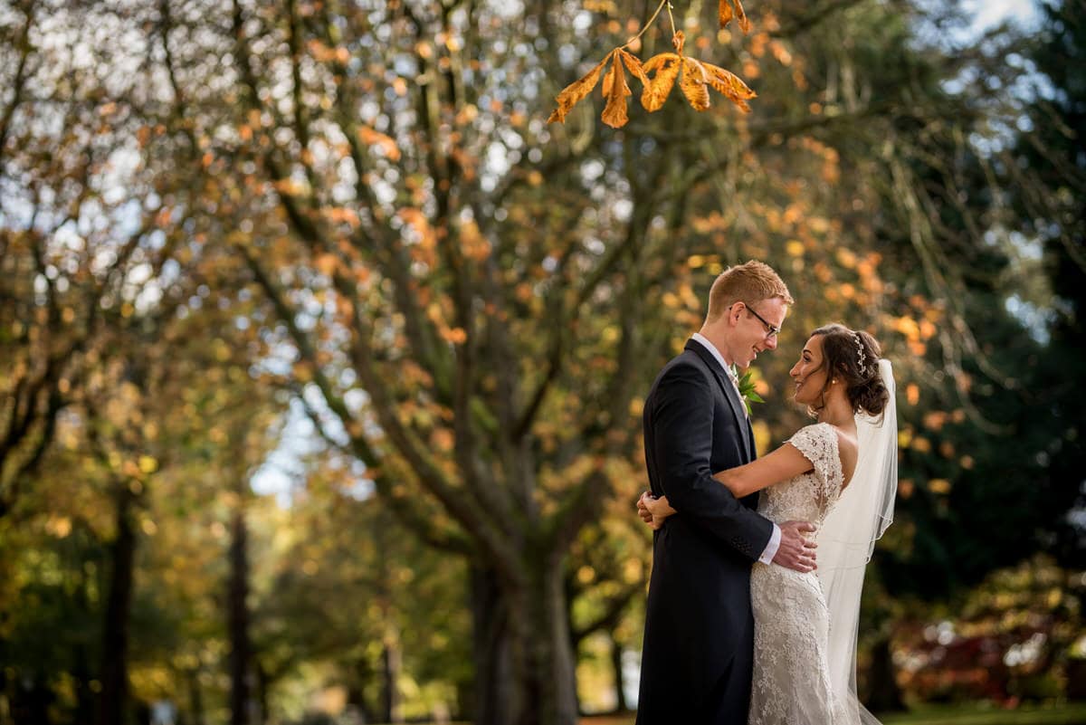 happy couple posing in gardens at colshaw hall