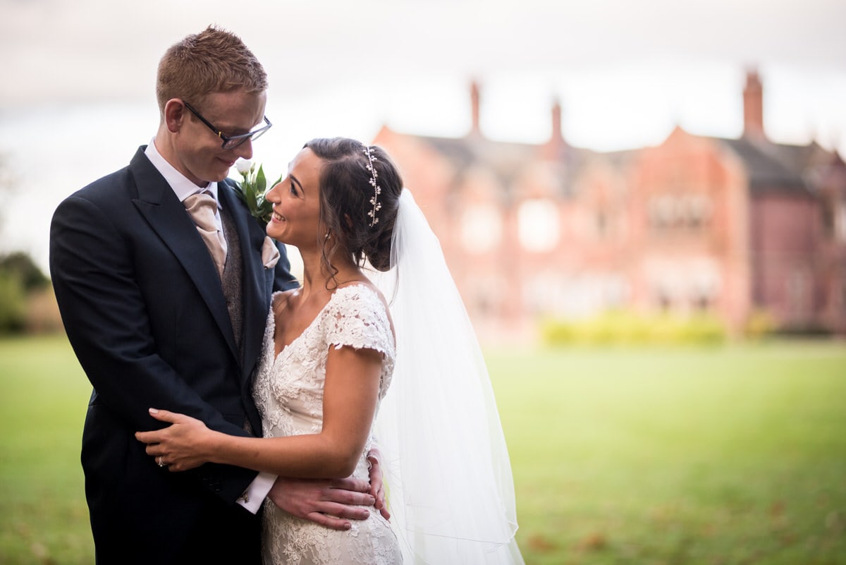 bride and groom in front of colshaw hall