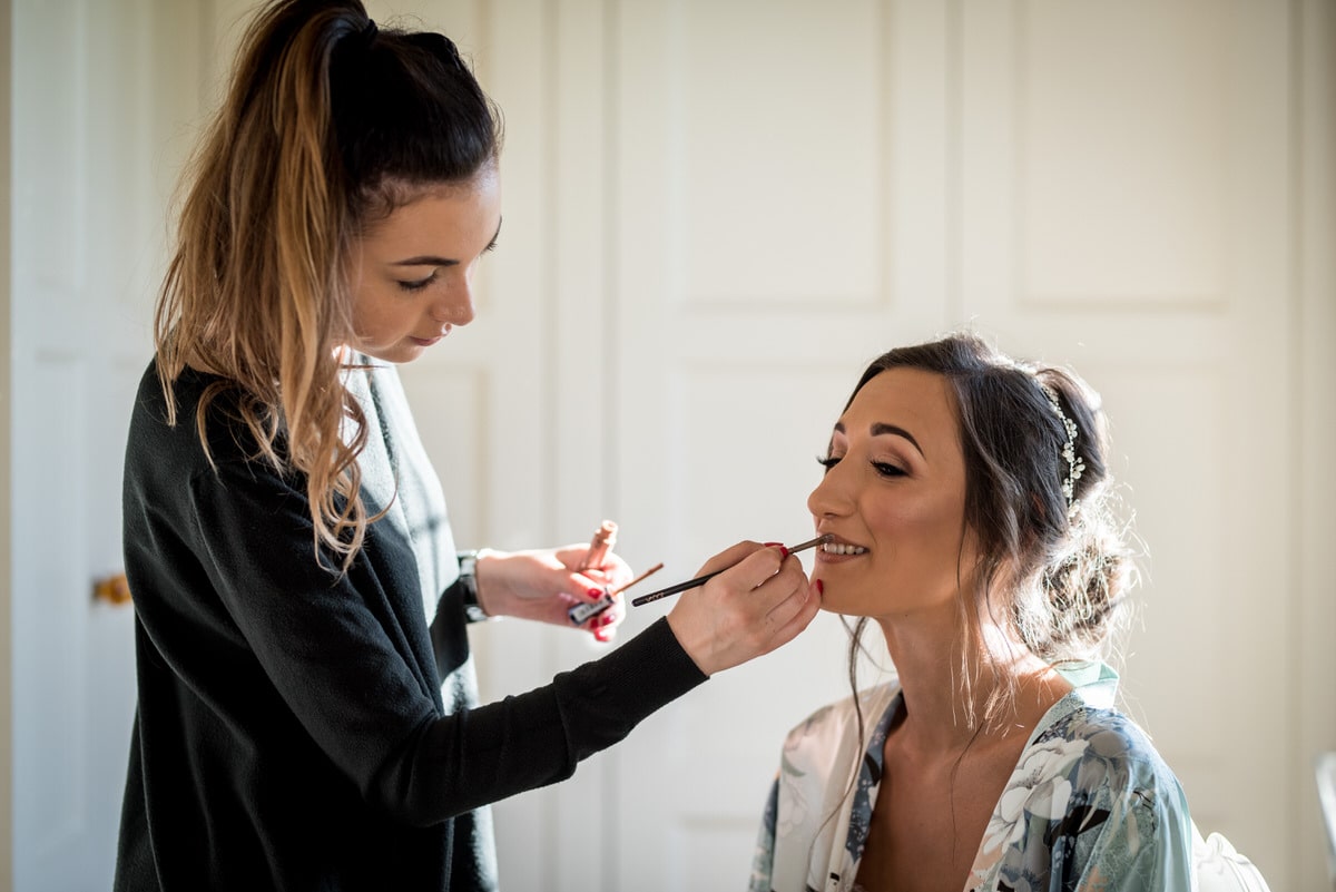 bride having lipstick applied at colshaw hall