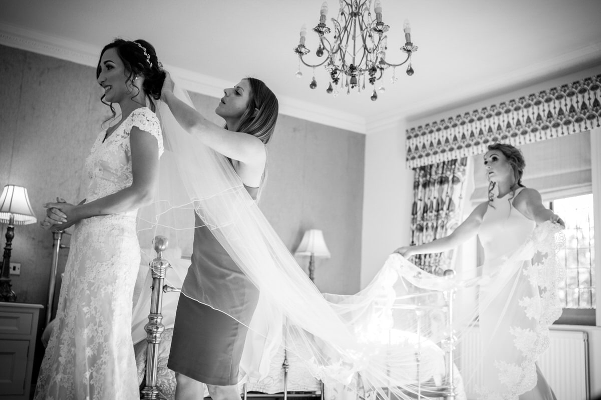 bride having her veil fitted