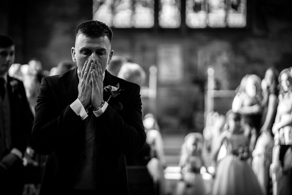 groom getting emotional as he sees his daughter