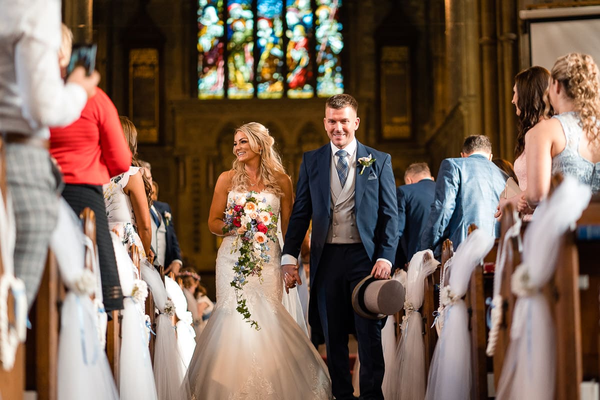 bride and groom walking down the aisle