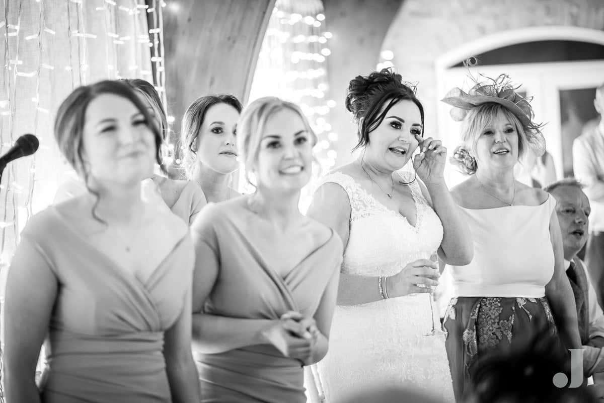 bride wiping tear from her eye