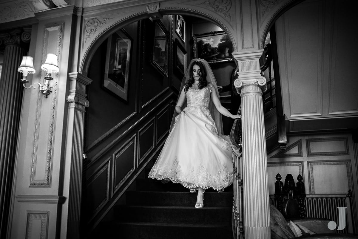 bride on stairs at Thornton Manor wedding