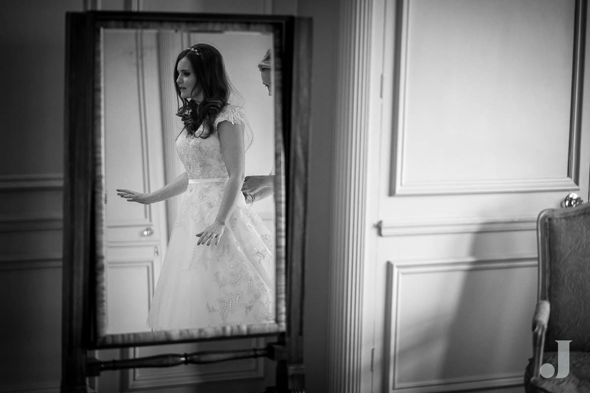 bride reflected in mirror at Thornton Manor