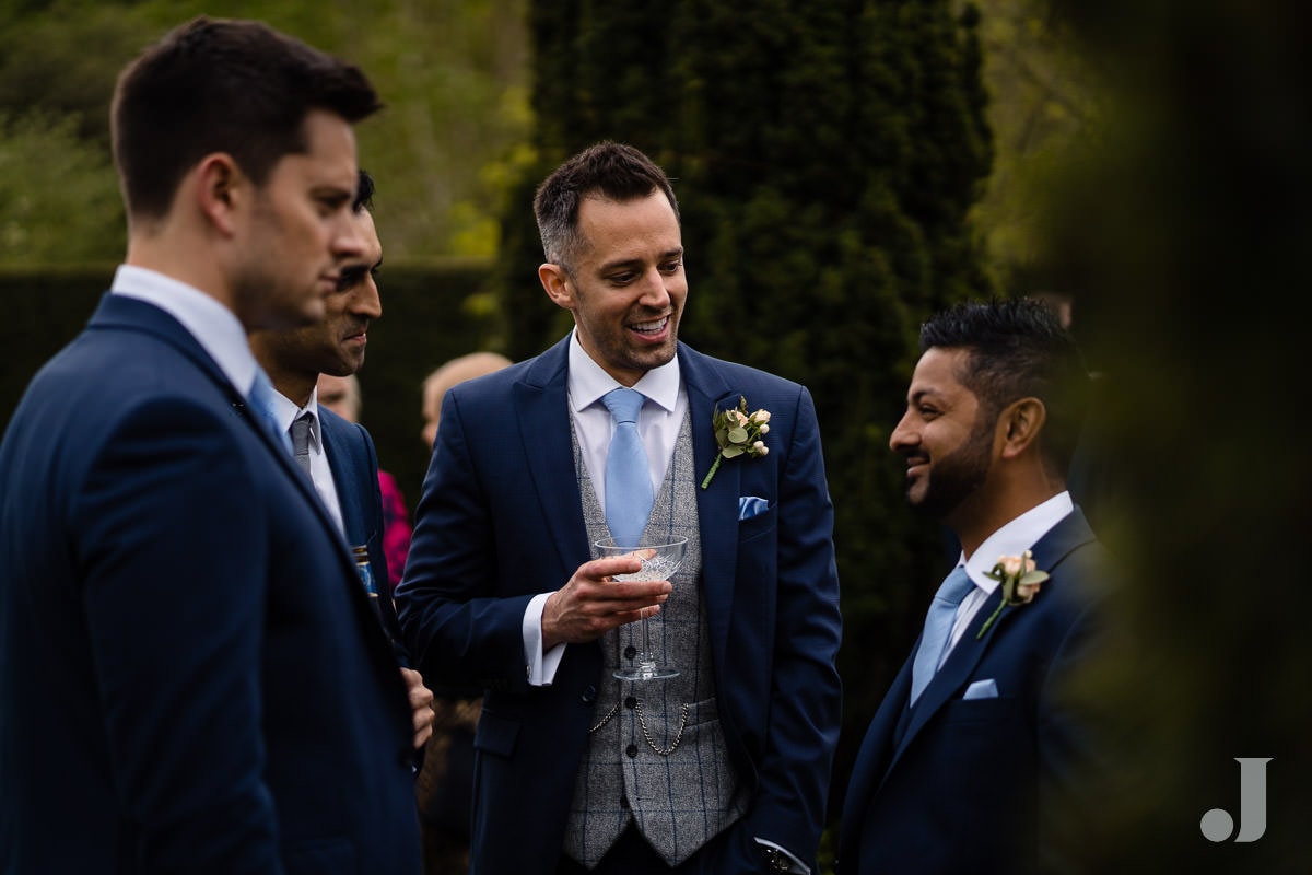 groom chatting to friends